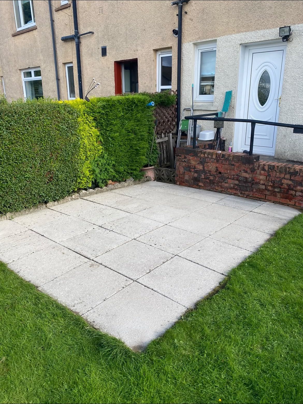 Front garden patio slabs clean after pressure washing